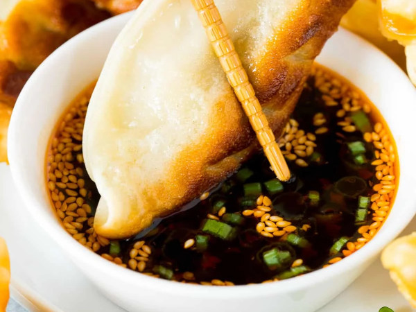 Fried Pork Dumplings Accompanied by Dipping Sauce