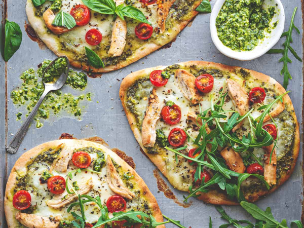 Naan Pizza Featuring Basil Pesto and Three Cheeses