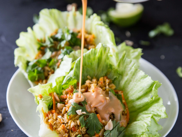 Cauliflower Rice Lettuce Wraps Drizzled with Spicy Peanut Sauce