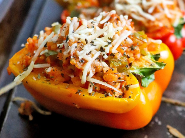 Bold Mediterranean Chicken Accompanied by Sausage-Stuffed Peppers