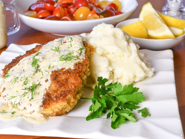 Tender Pork Cutlets in a Creamy Chanterelle Sauce, Accompanied by Dill Potatoes