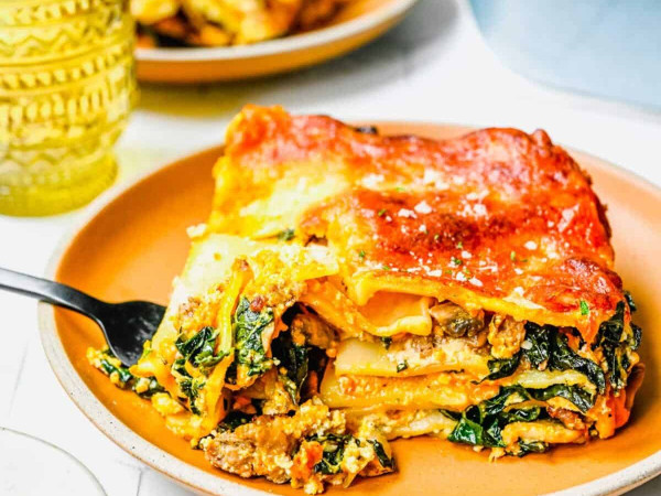 Hearty Lasagna Featuring Smoked Sausage, Pumpkin, and Collard Greens