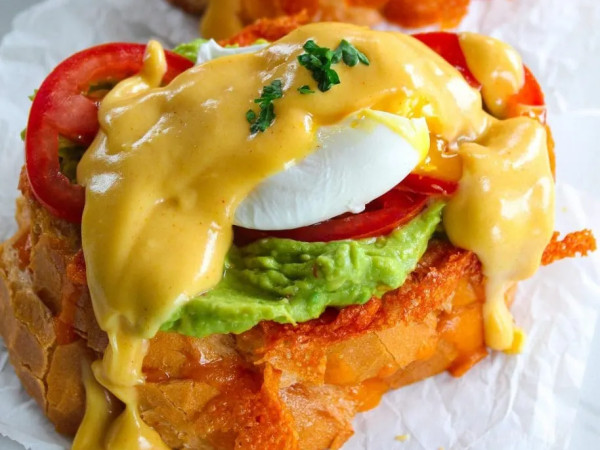 Benedict with Sausage, Avocado, and Creamy White Cheddar Sauce