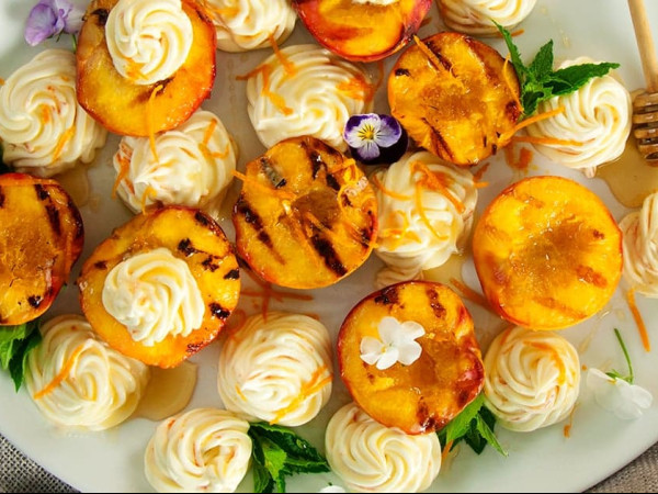 Toast topped with Grilled Peaches, Creamy Mascarpone, and Honey