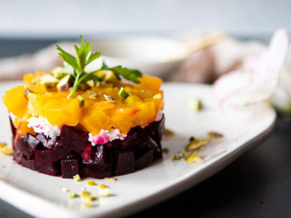 Sweet Potato and Beet Noodle Salad with Goat Cheese Medallions and Pistachio Dressing